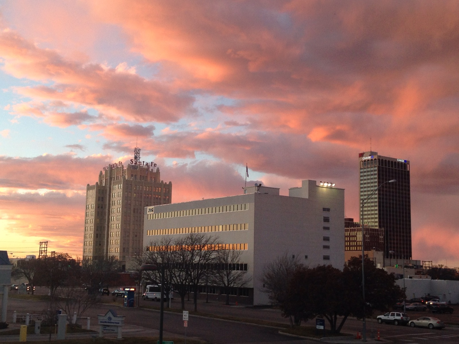 Pink and orange clouds at sunset over downtown Amarillo in January
